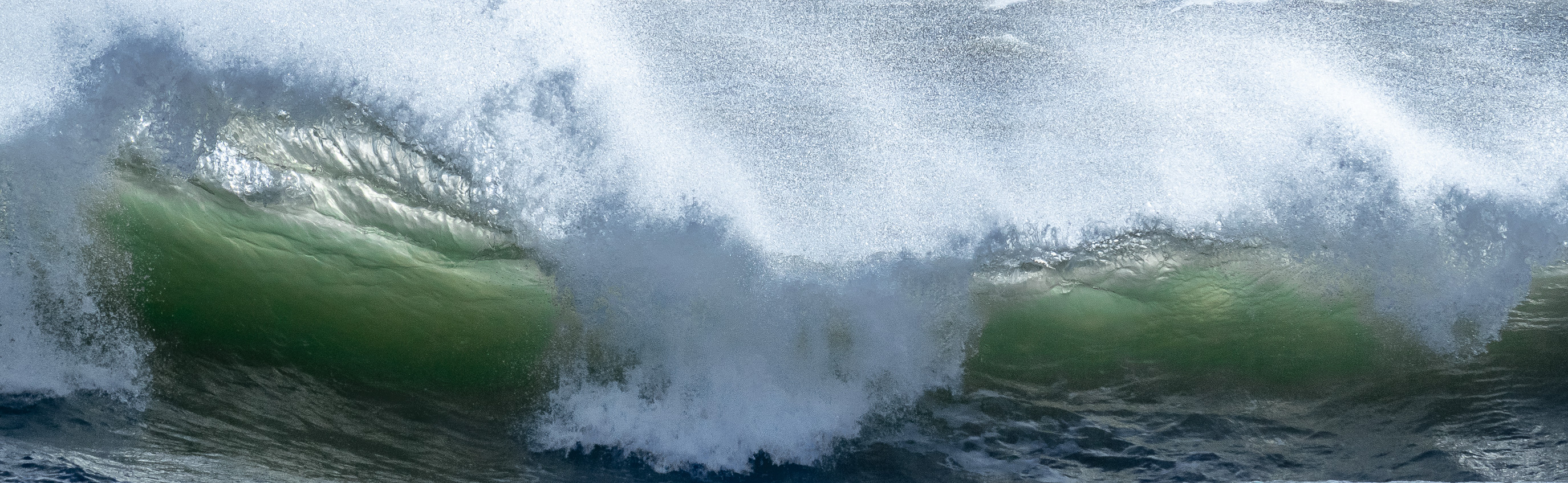 Photo of a large wave crashing