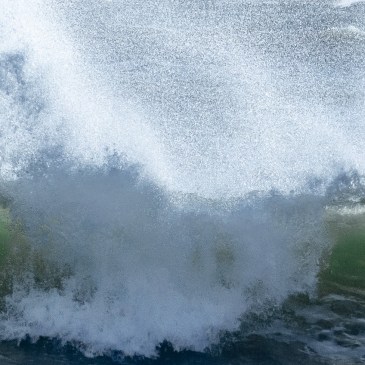 Photo of a large wave crashing